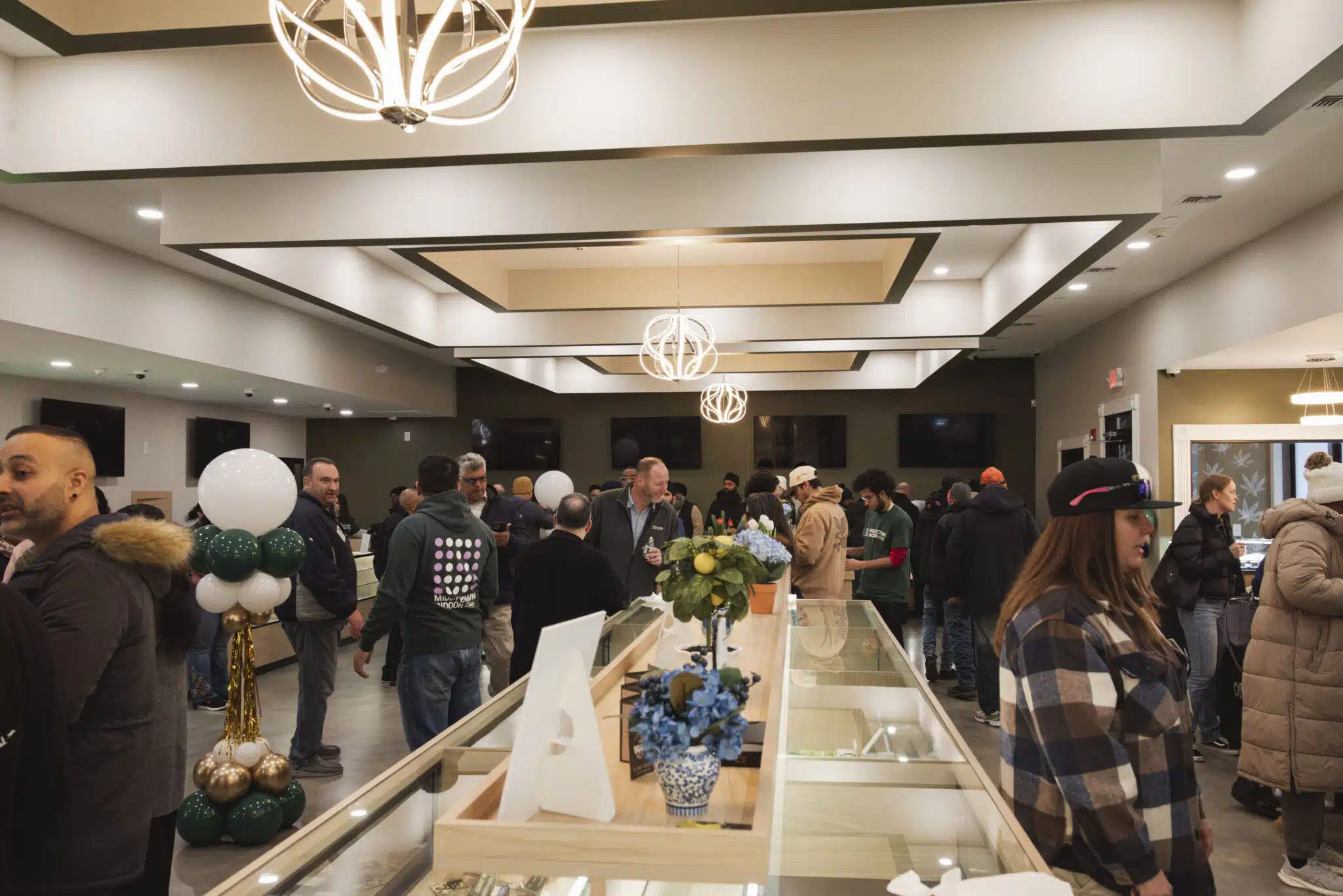 A crowd of customers filling the store on opening day.